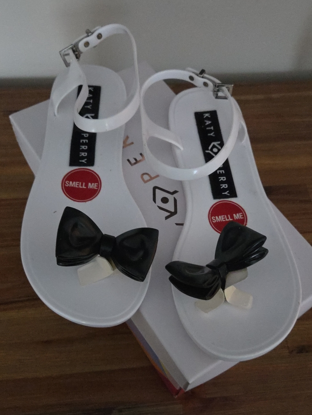 Katy Perry Collections White Jelly Sandals with Black Bow Accent